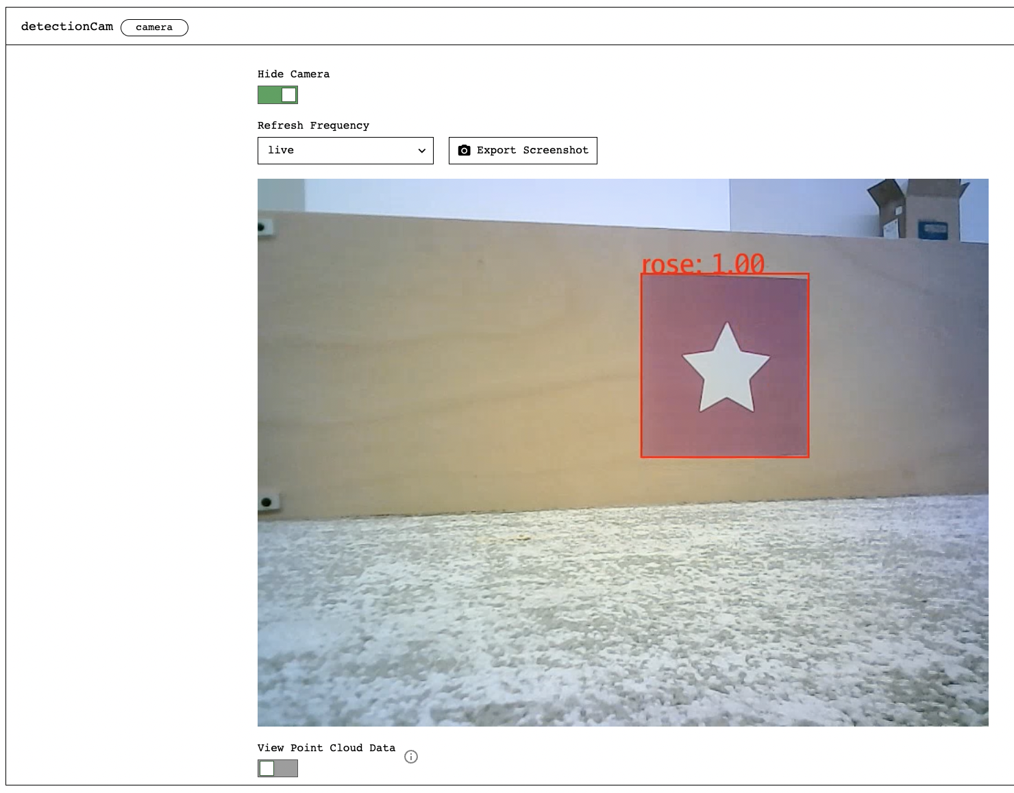 Screenshot from the Viam app showing the detectionCam component panel. The Hide Camera button is green. The Refresh Frequency selector is set to live, and the Export Frequency button is beside it on the right. The detectionCam stream is visible and displays a red square surrounded by a red a color detection box labeled Rose:1.00.